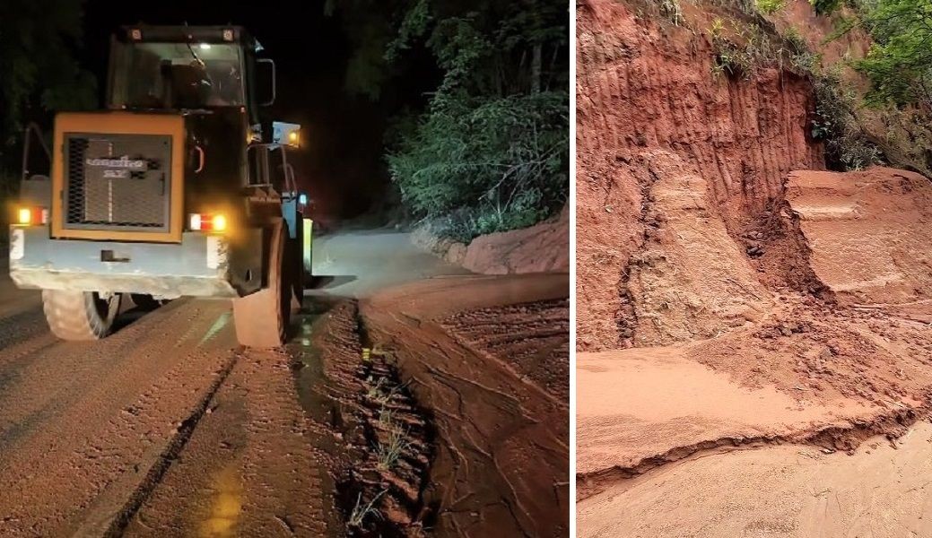 Máquina realizando intervenção em trecho da rodovia ES-484 após deslizamento de terra, com barranco de terra vermelha parcialmente cedido às margens da pista em Bom Jesus do Norte.