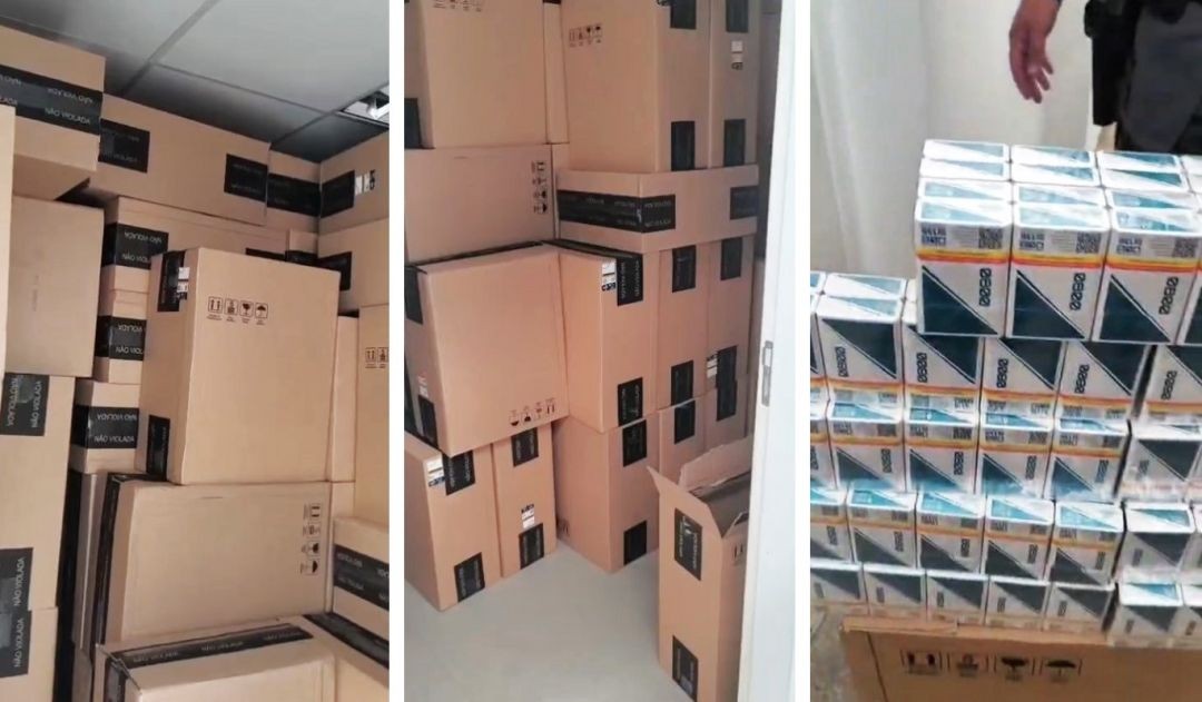 Caminhão carregado com diversas caixas de papelão empilhadas, contendo cigarros apreendidos durante fiscalização na BR-482, onde estavam pilhas de caixas de cigarros organizadas no interior de um caminhão após apreensão realizada por forças de segurança e Receita Estadual no município de Alegre.