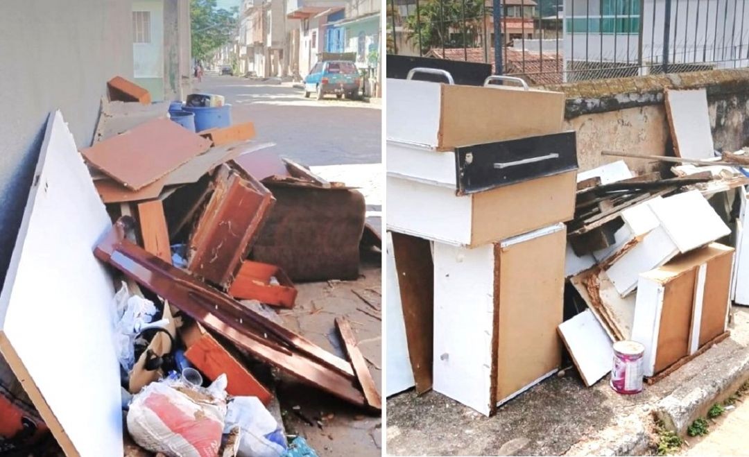 Imagem mostra móveis velhos, pedaços de madeira, armários desmontados, colchão e outros resíduos descartados irregularmente em calçadas e via pública em Guaçuí, evidenciando acúmulo de lixo urbano em área residencial.